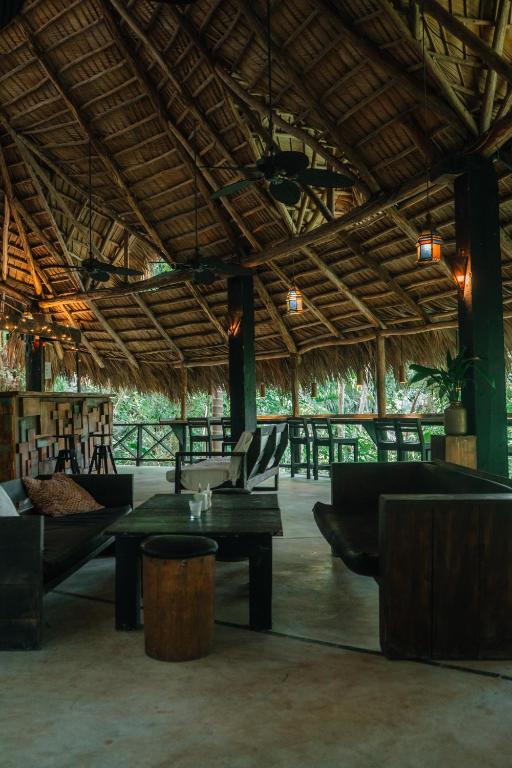 a living room with couches and tables in a building at ZÂRIA Hotel & Retreat Center in El Valle