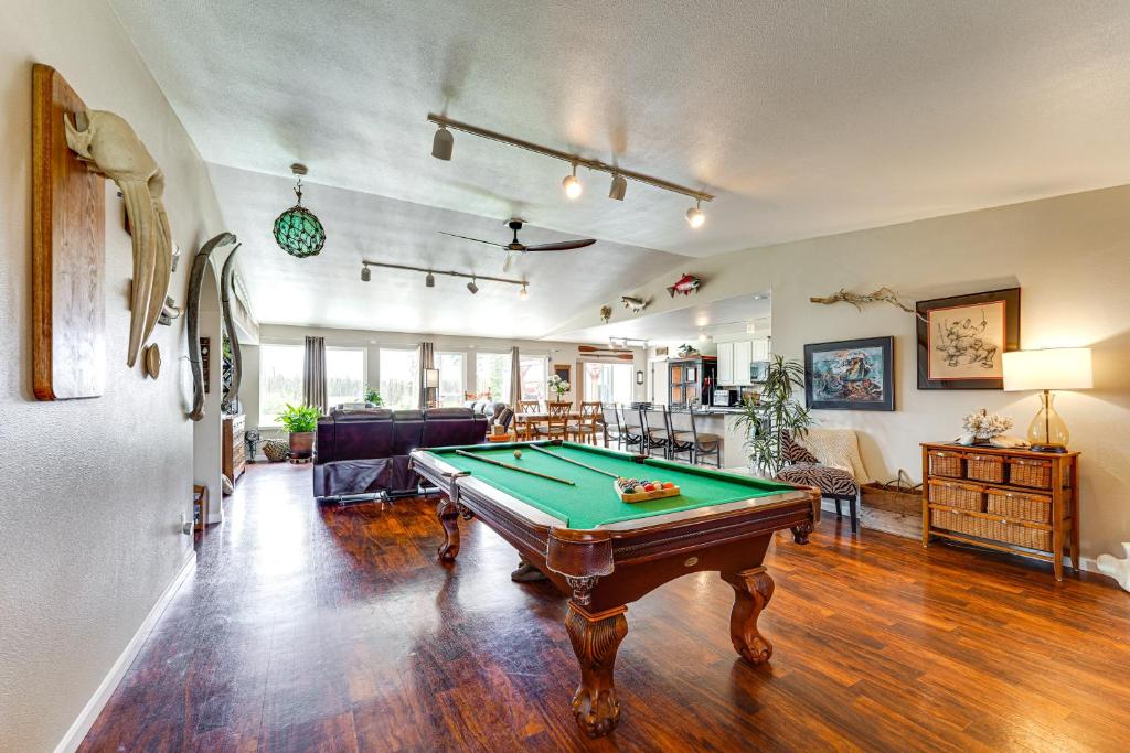 a living room with a pool table in it at Soldotna Home with Yard, Walk to Kenai River! in Soldotna