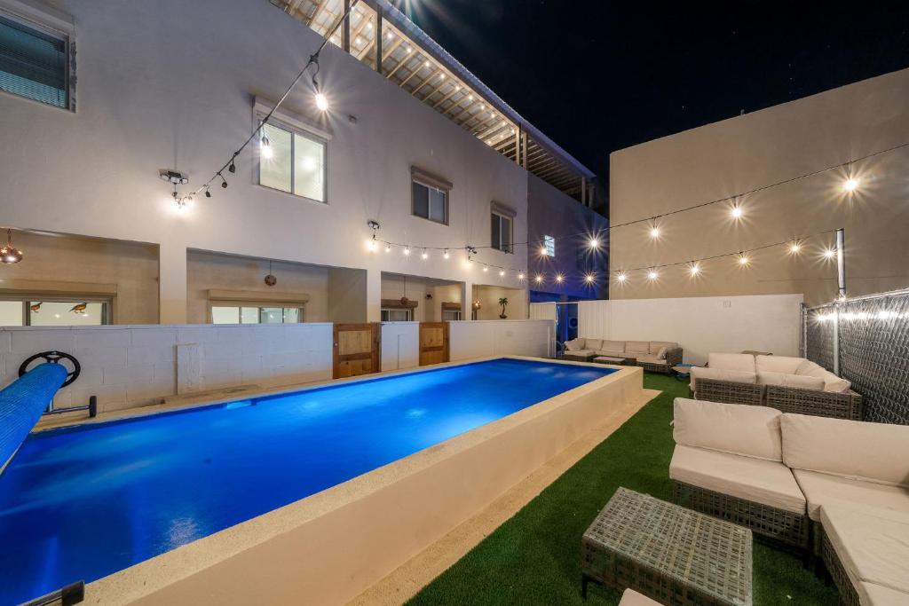 a swimming pool in a living room with a pool house at 3 Story Home 3BR 2BA with Rooftop View and Heated Pool in La Choya