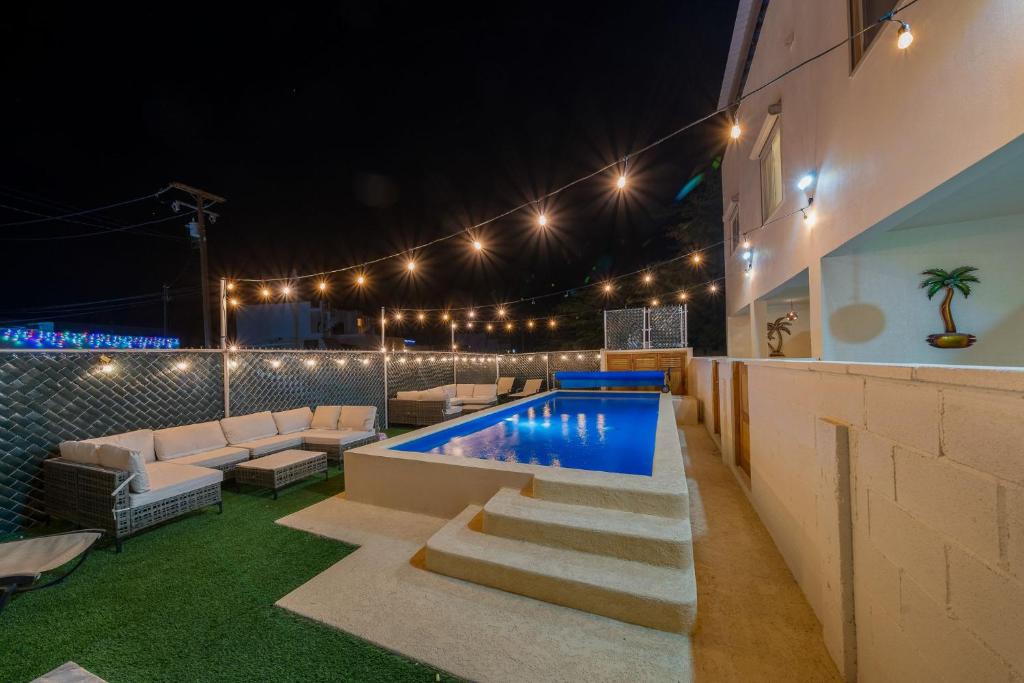 a patio with a swimming pool at night at 3 Story Home 3BR 2BA with Rooftop View and Heated Pool in La Choya