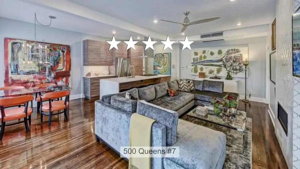 a living room with a couch and a table at Modern 2BR Condo with Sunroom near Uptown in Charlotte