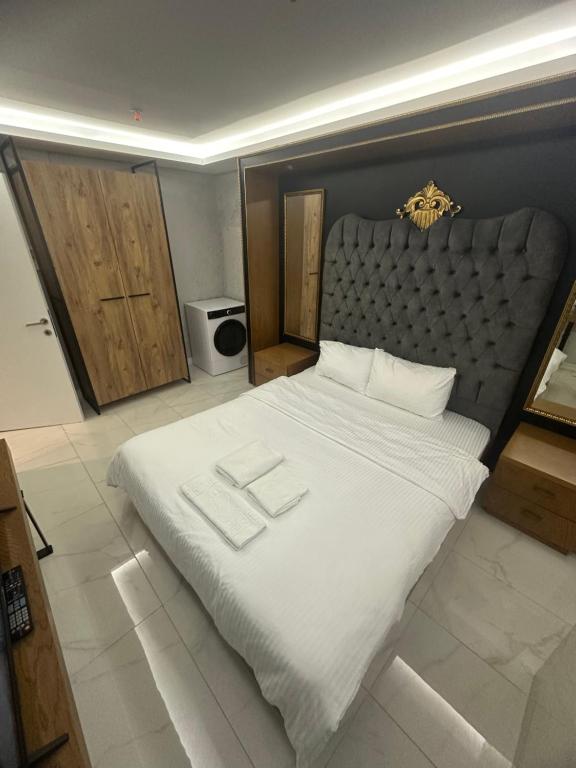 A bed or beds in a room at Ottomare Suites luxury apartment with pool with amazing view