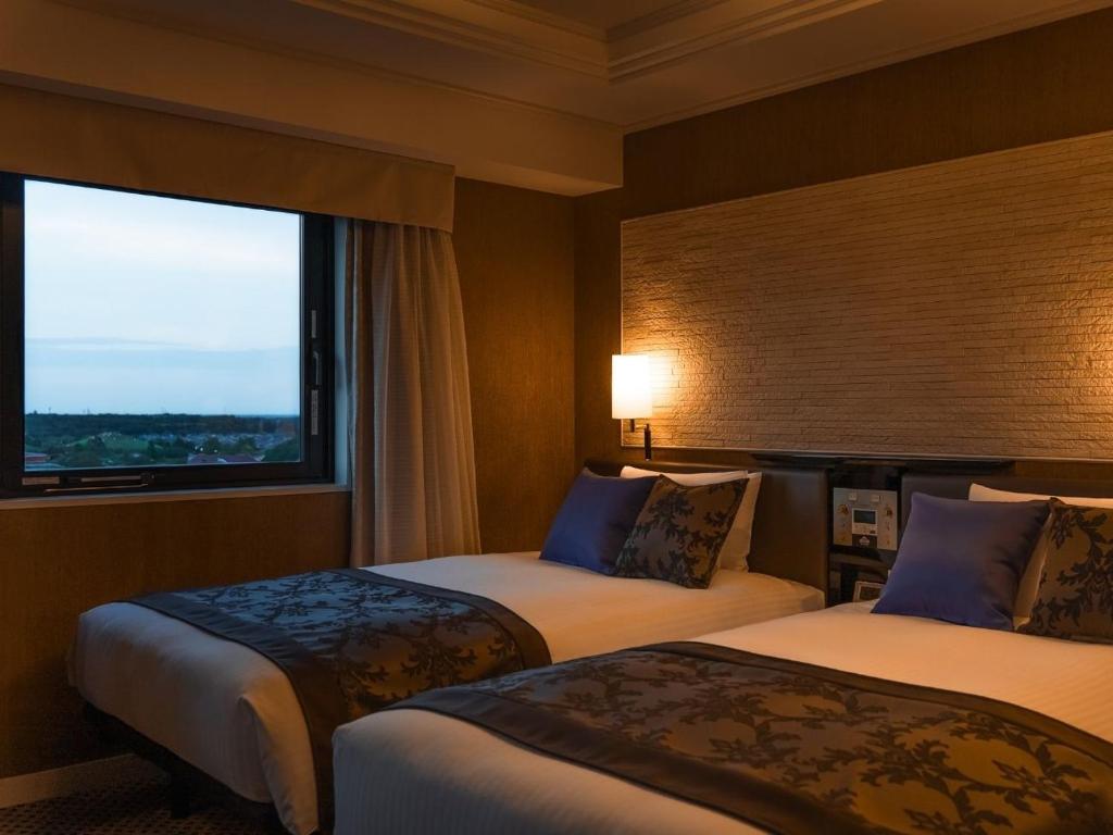 Postel nebo postele na pokoji v ubytování Graces Hotels