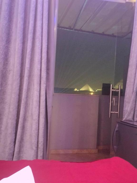 Postel nebo postele na pokoji v ubytování pyramids egypticano