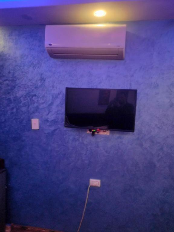 TV a/nebo společenská místnost v ubytování pyramids egypticano