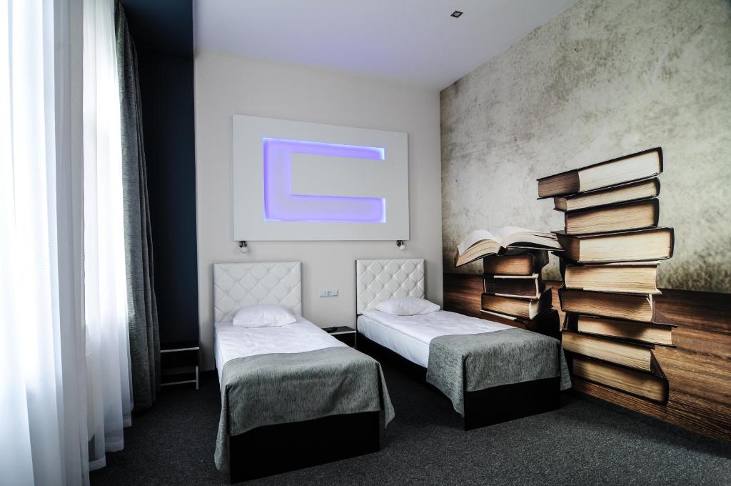 Postel nebo postele na pokoji v ubytování Homelike Hotel