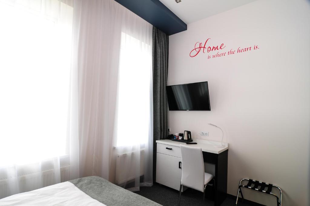 TV a/nebo společenská místnost v ubytování Homelike Hotel