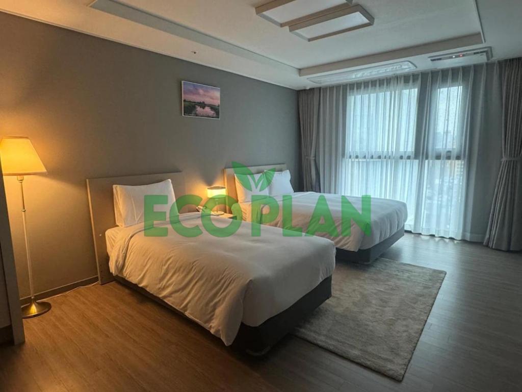 Postel nebo postele na pokoji v ubytování Sollago Myeongdong Hotel & Residence