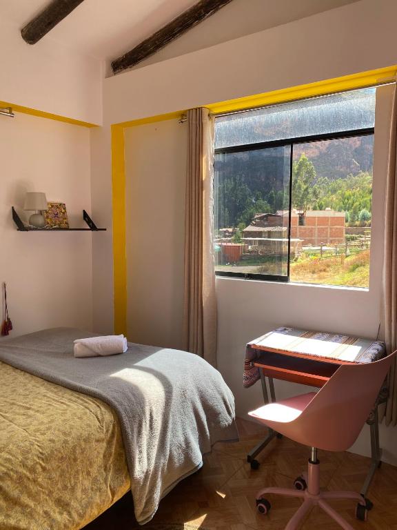 Postel nebo postele na pokoji v ubytování Colibri Wasi Pisac