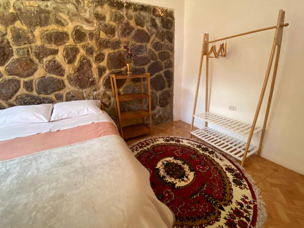 Postel nebo postele na pokoji v ubytování Colibri Wasi Pisac
