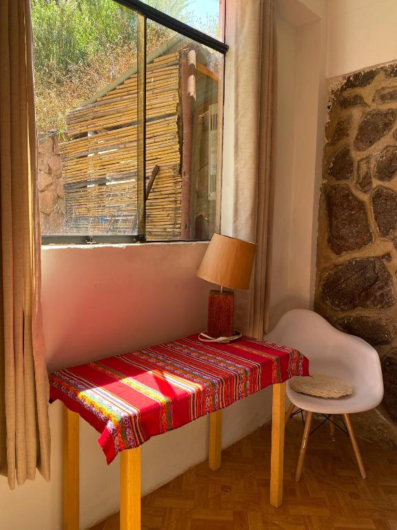 Postel nebo postele na pokoji v ubytování Colibri Wasi Pisac