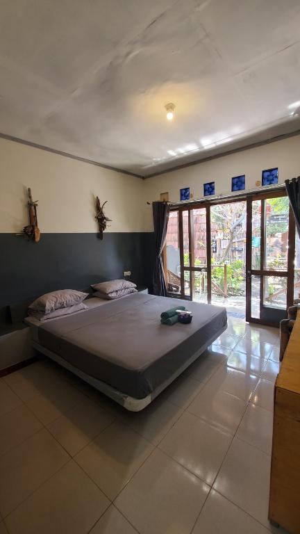 Postel nebo postele na pokoji v ubytování Bintang Guesthouse