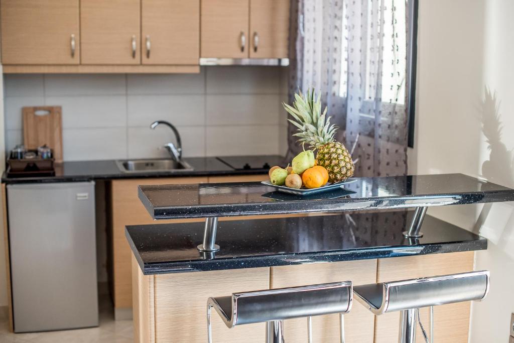 Kuchyň nebo kuchyňský kout v ubytování Golden Sun Villas