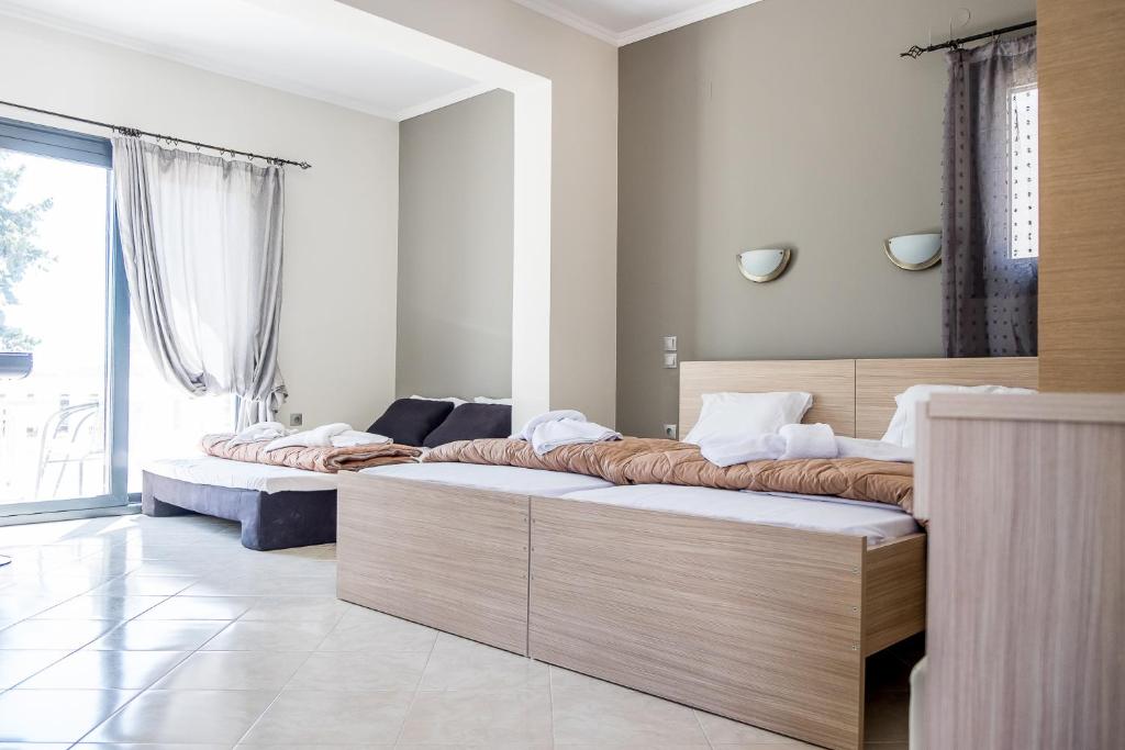 Postel nebo postele na pokoji v ubytování Golden Sun Villas