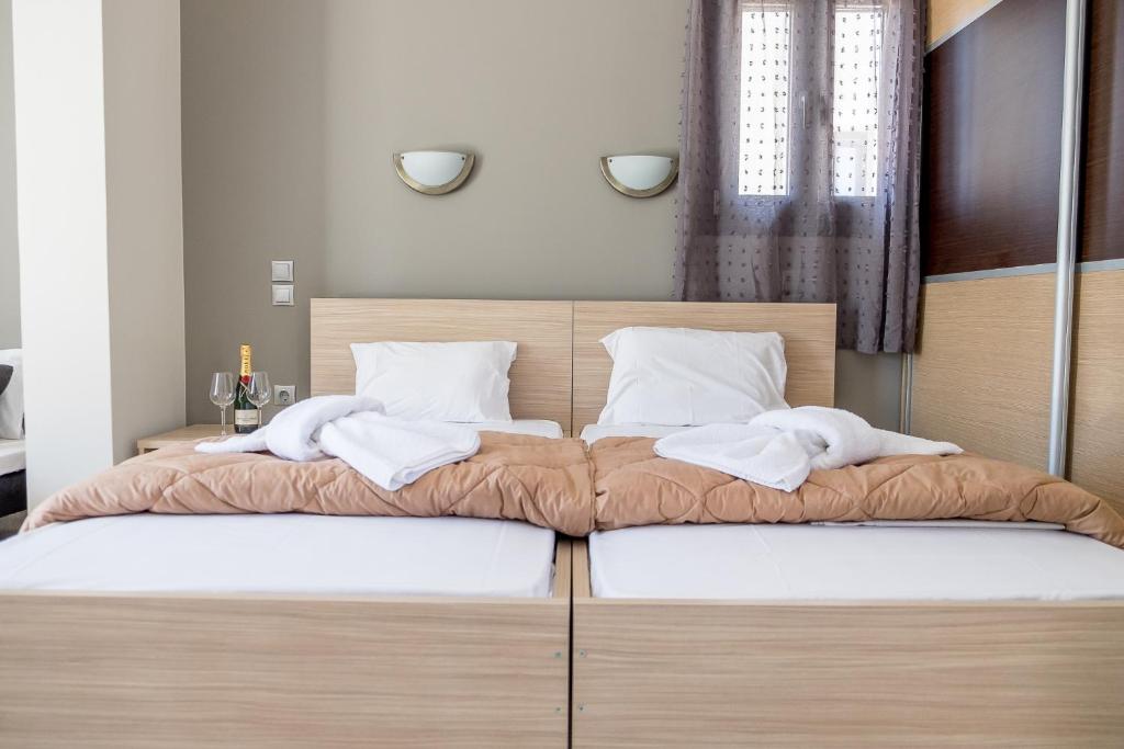 Postel nebo postele na pokoji v ubytování Golden Sun Villas