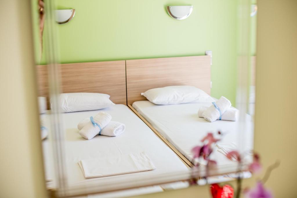 Postel nebo postele na pokoji v ubytování Golden Sun Villas