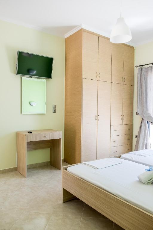 Postel nebo postele na pokoji v ubytování Golden Sun Villas
