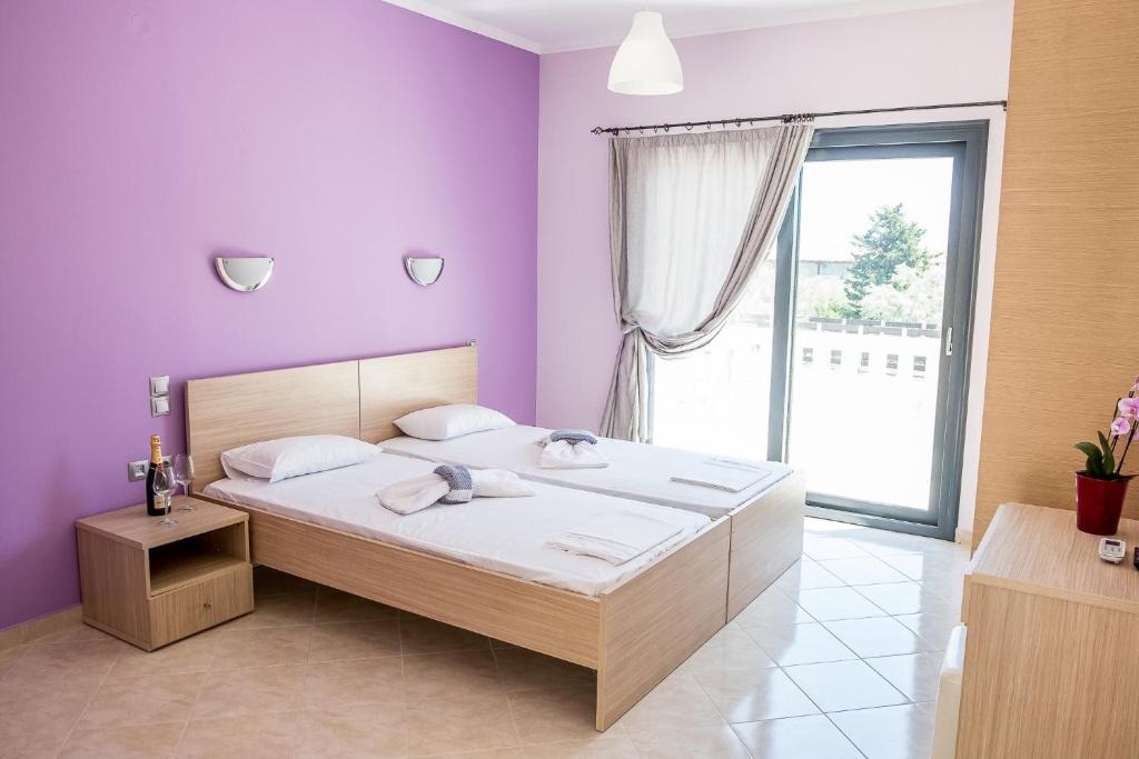 Postel nebo postele na pokoji v ubytování Golden Sun Villas