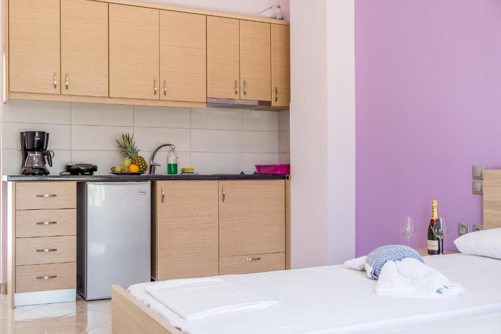 Postel nebo postele na pokoji v ubytování Golden Sun Villas