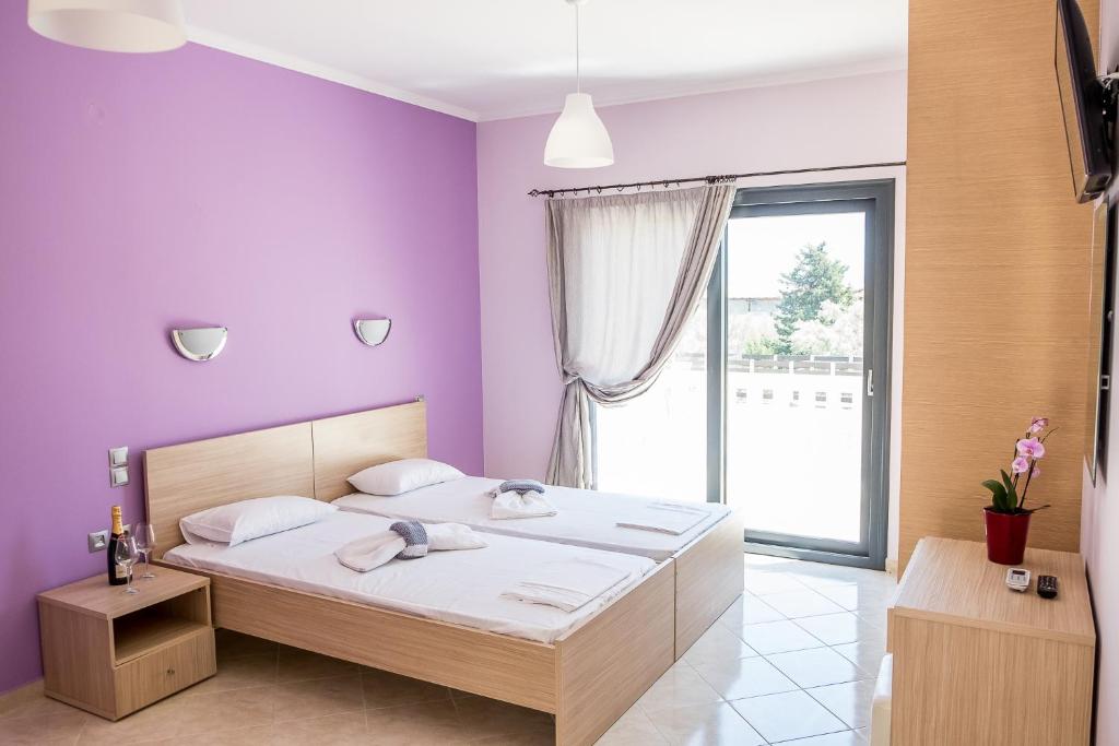 Postel nebo postele na pokoji v ubytování Golden Sun Villas