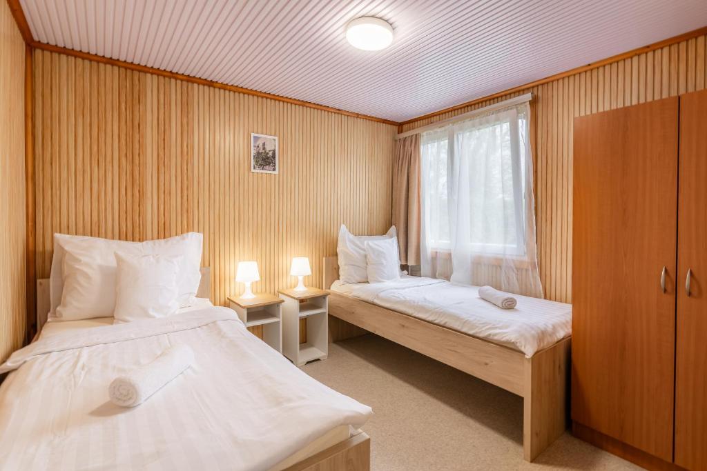 Voodi või voodid majutusasutuse Heu Réka Vendégház toas