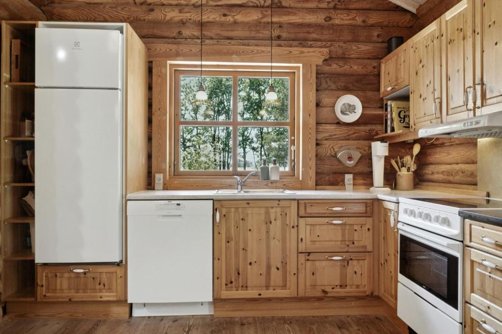 Fotografie z fotogalerie ubytování Nordic Log Cabin With Views Over The Fields v destinaci Hals