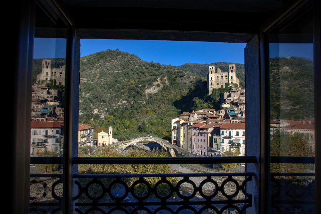 a view of a city from a window at Il Nido di Rondine in Dolceacqua
