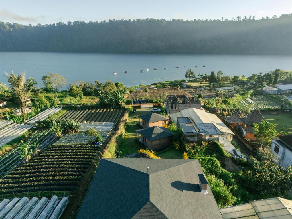 an aerial view of a town with a lake at Kibubu Forever Bali in Bedugul