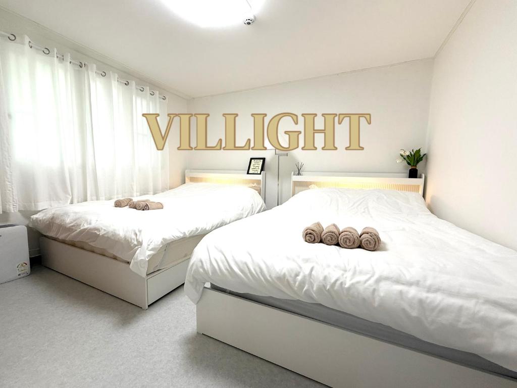 Ένα ή περισσότερα κρεβάτια σε δωμάτιο στο Villight