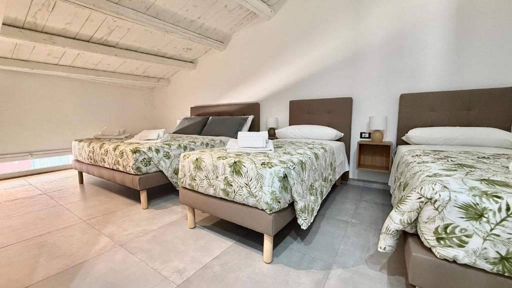 Postel nebo postele na pokoji v ubytování Kyansa Sicily a Pachino