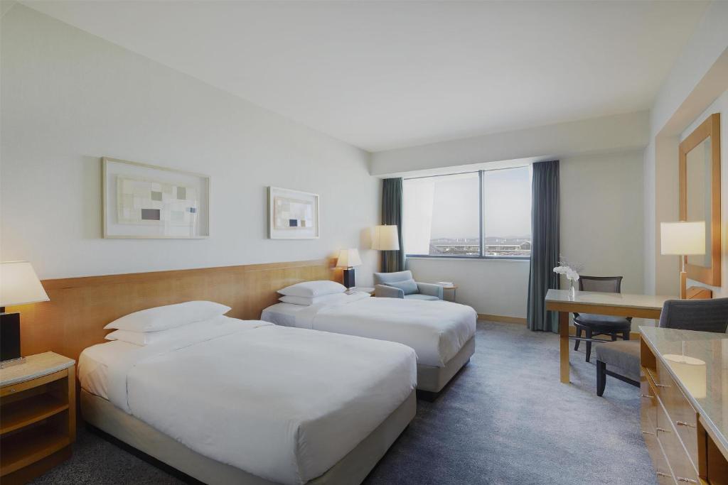 Postel nebo postele na pokoji v ubytování Grand Hyatt Incheon