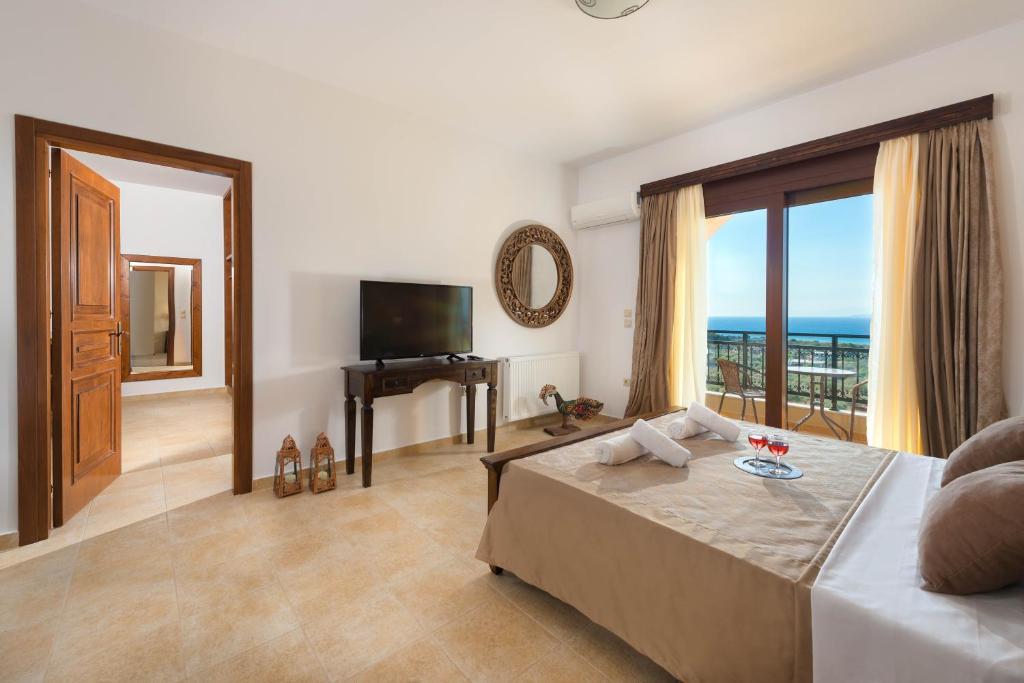 A television and/or entertainment centre at Butterfly Villa with stunning Sea and Valley Views