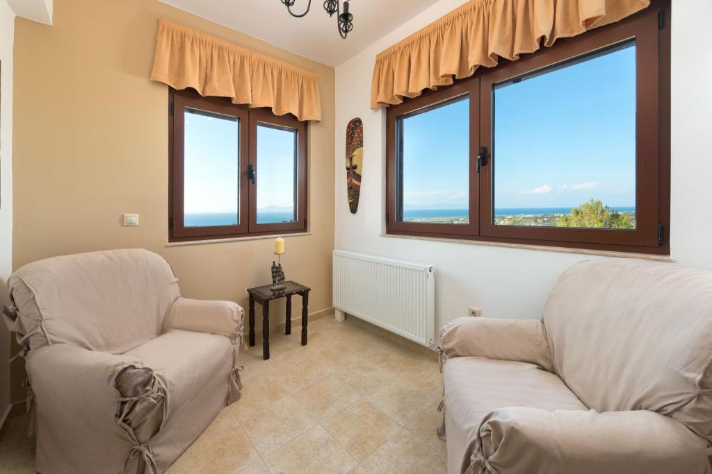A seating area at Butterfly Villa with stunning Sea and Valley Views