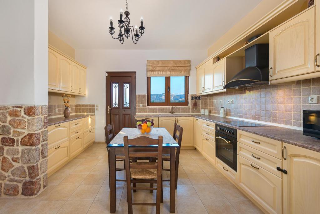 A kitchen or kitchenette at Butterfly Villa with stunning Sea and Valley Views