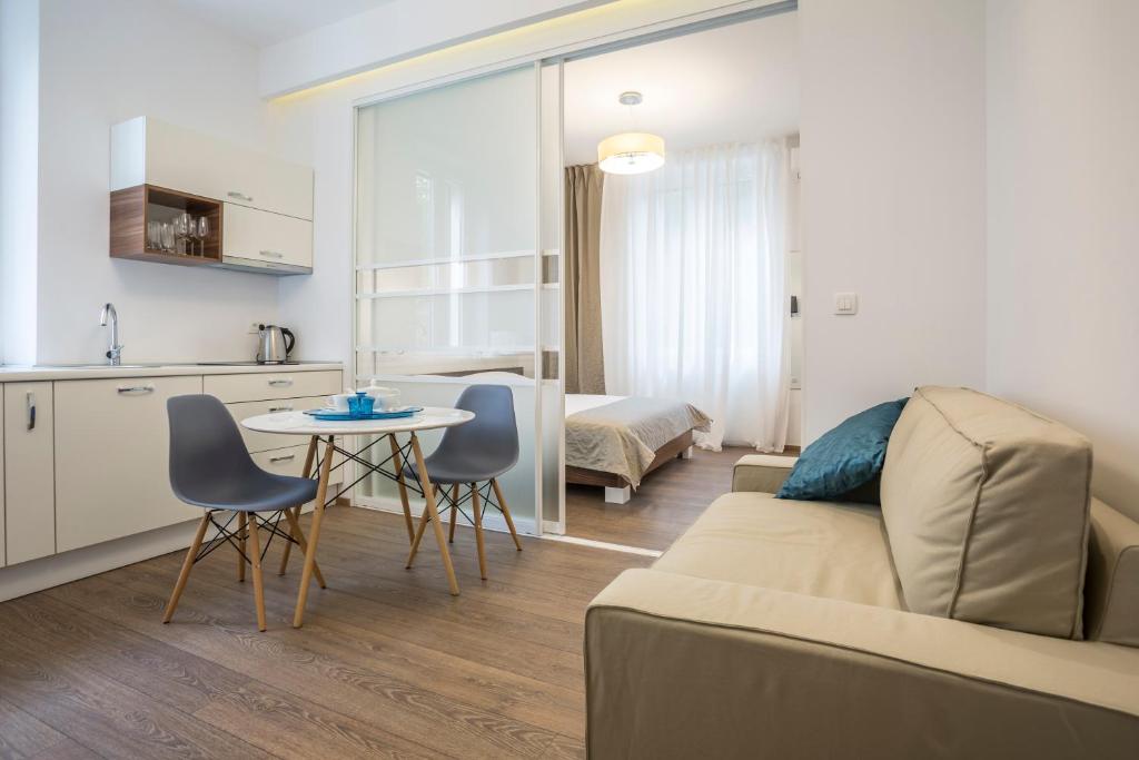 a living room with a couch and a table at Luxury Accommodation Marino in Split