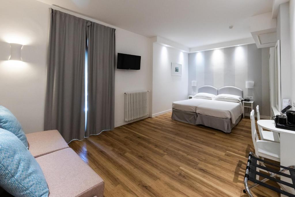 Postel nebo postele na pokoji v ubytování Hotel Beau Rivage