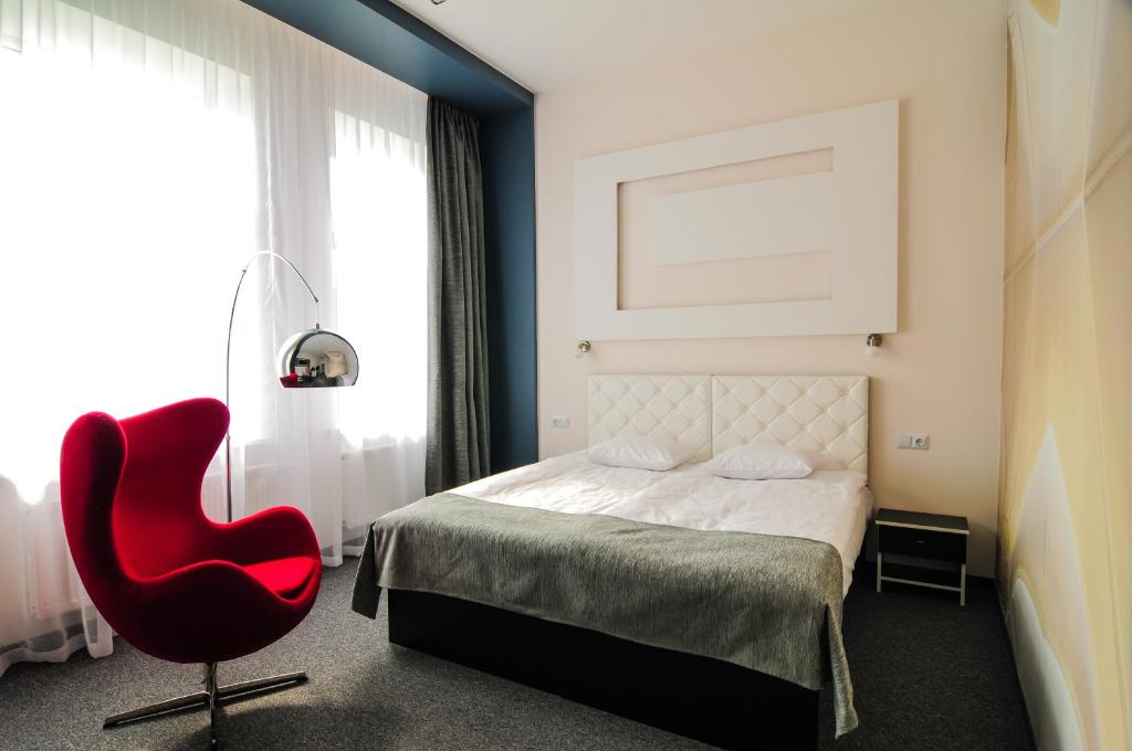 Postel nebo postele na pokoji v ubytování Homelike Hotel