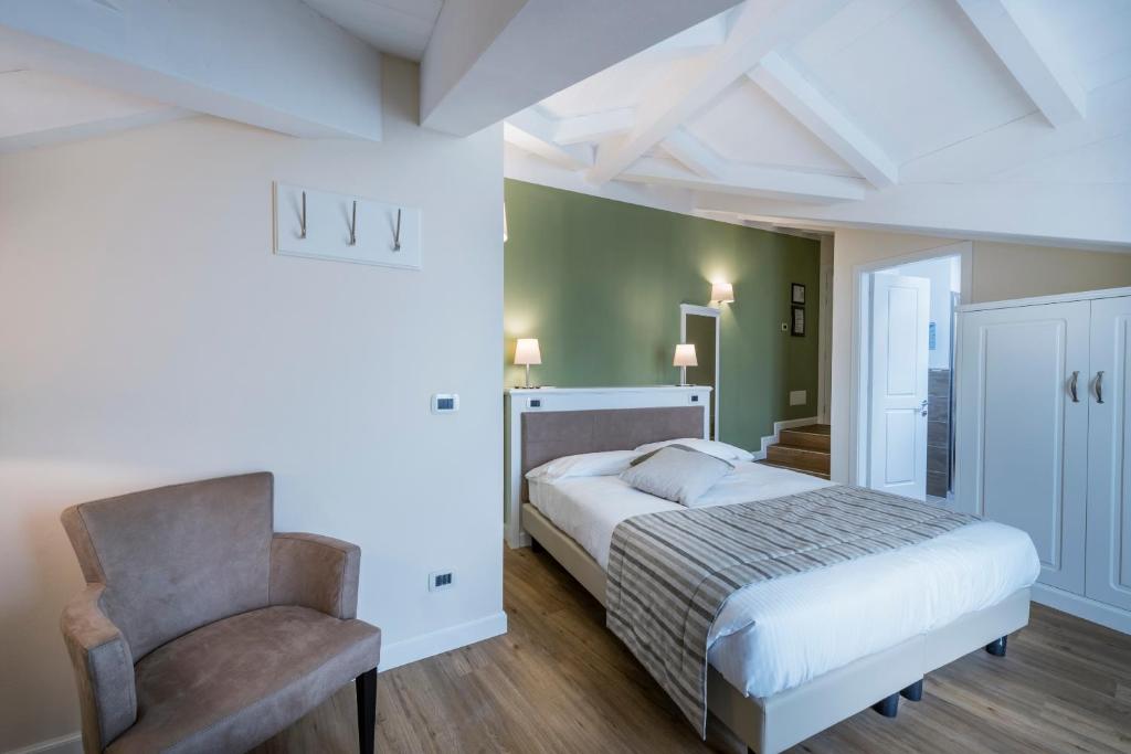 Postel nebo postele na pokoji v ubytování Hotel Garni Corona