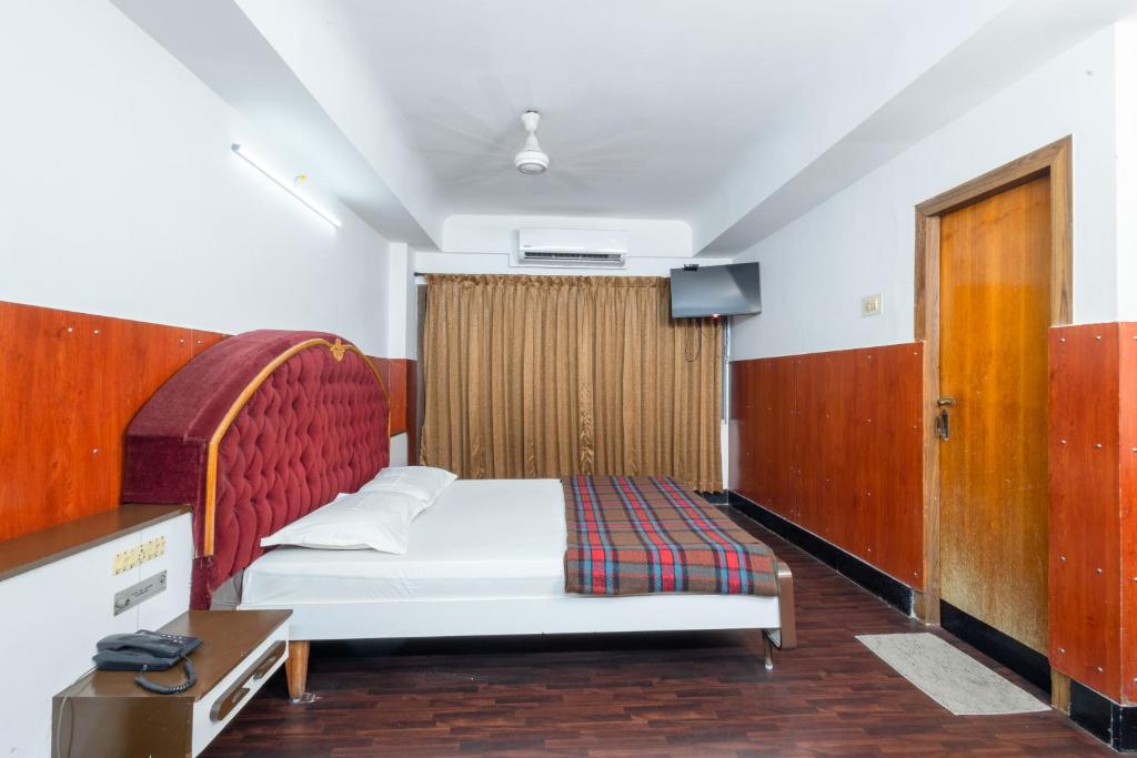 Postel nebo postele na pokoji v ubytování Hotel Srilakshmi