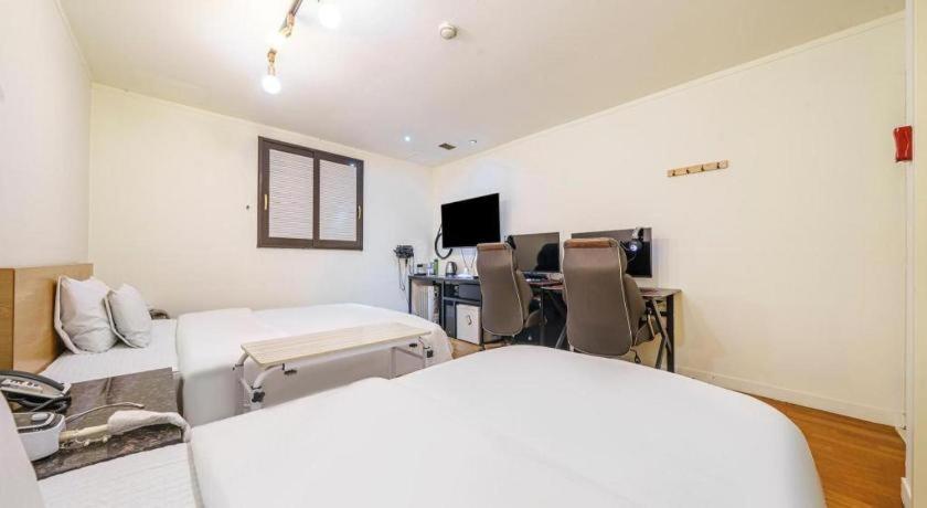 Postel nebo postele na pokoji v ubytování Yongin Valentine