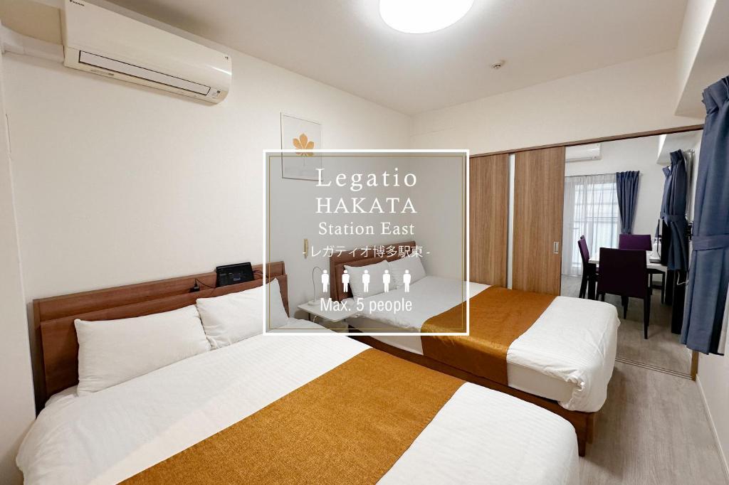 Postel nebo postele na pokoji v ubytování Legatio HAKATA Station East
