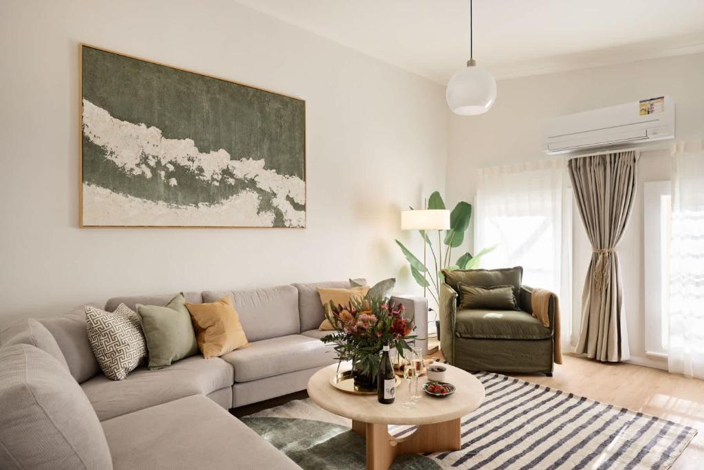 a living room with a couch and a table at The Brass Bear in Darlinghurst in Sydney