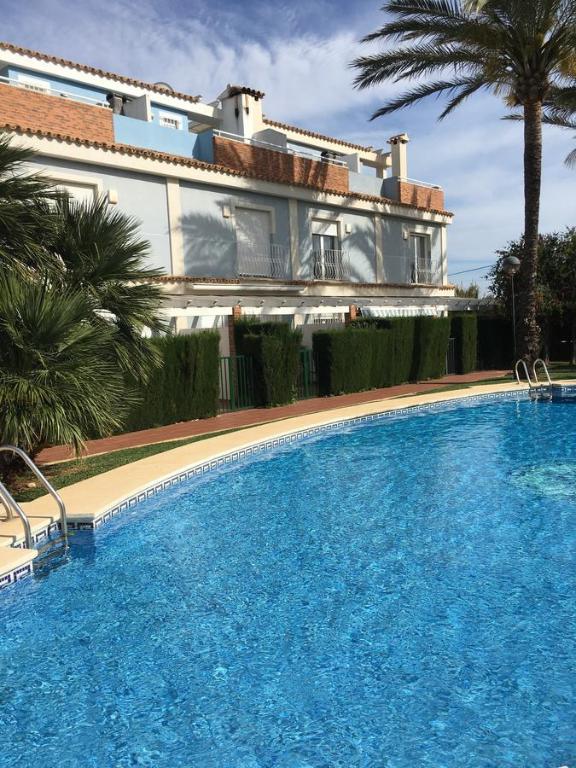 Bazén v ubytování Adosado Playa Almadrava nebo v jeho okolí