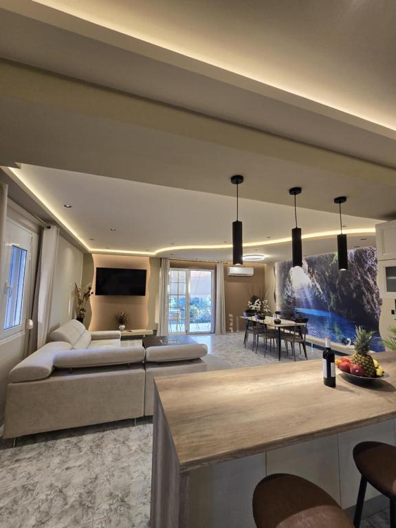 a large living room with a couch and a table at Popi's apartment in Argostoli