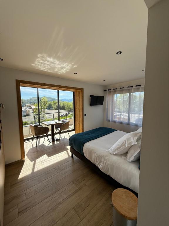 Postel nebo postele na pokoji v ubytování Appart Hôtel Le JAS
