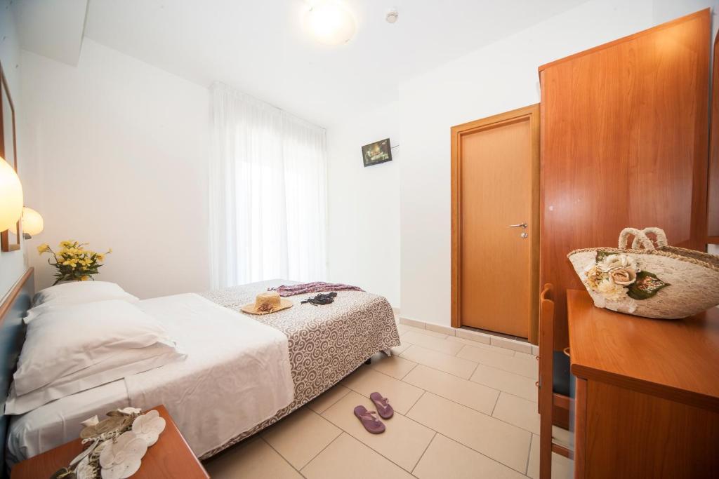 Postel nebo postele na pokoji v ubytování Hotel Taormina
