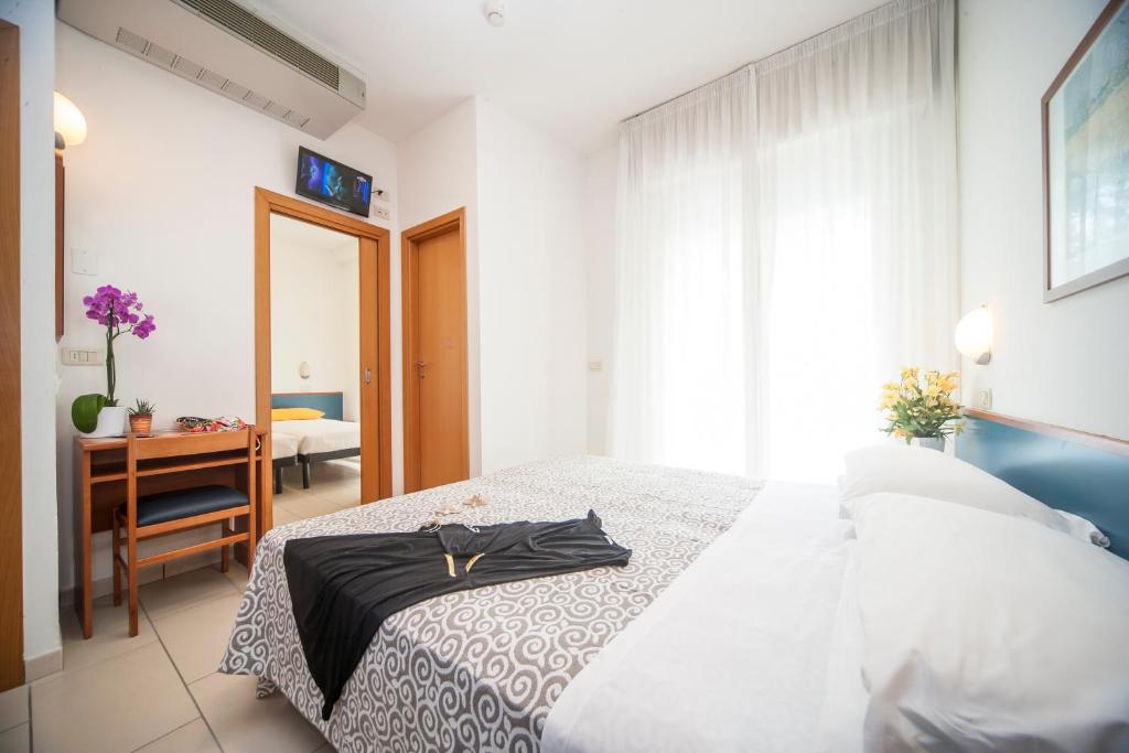Postel nebo postele na pokoji v ubytování Hotel Taormina