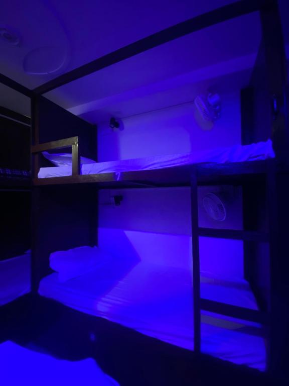 Ένα ή περισσότερα κρεβάτια σε δωμάτιο στο Cozy Inn Hostel