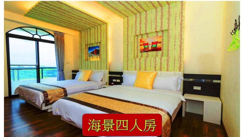 Postel nebo postele na pokoji v ubytování 海漣天海岸民宿 & 水連天海景電梯民宿 Sea Sky Coast Homestay & Shui-lian-tian Homestay