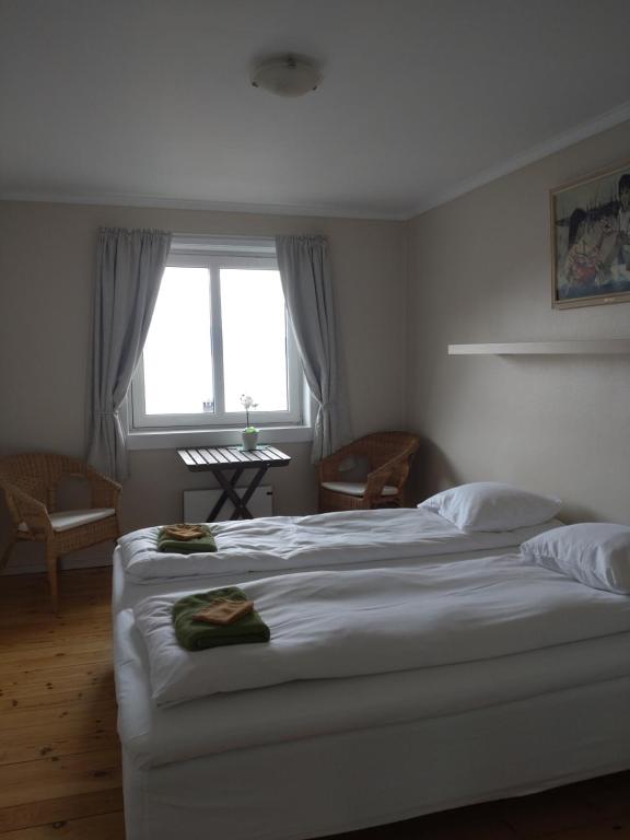 Postel nebo postele na pokoji v ubytování Hardanger Rom & Harmonium "The Green B&B"